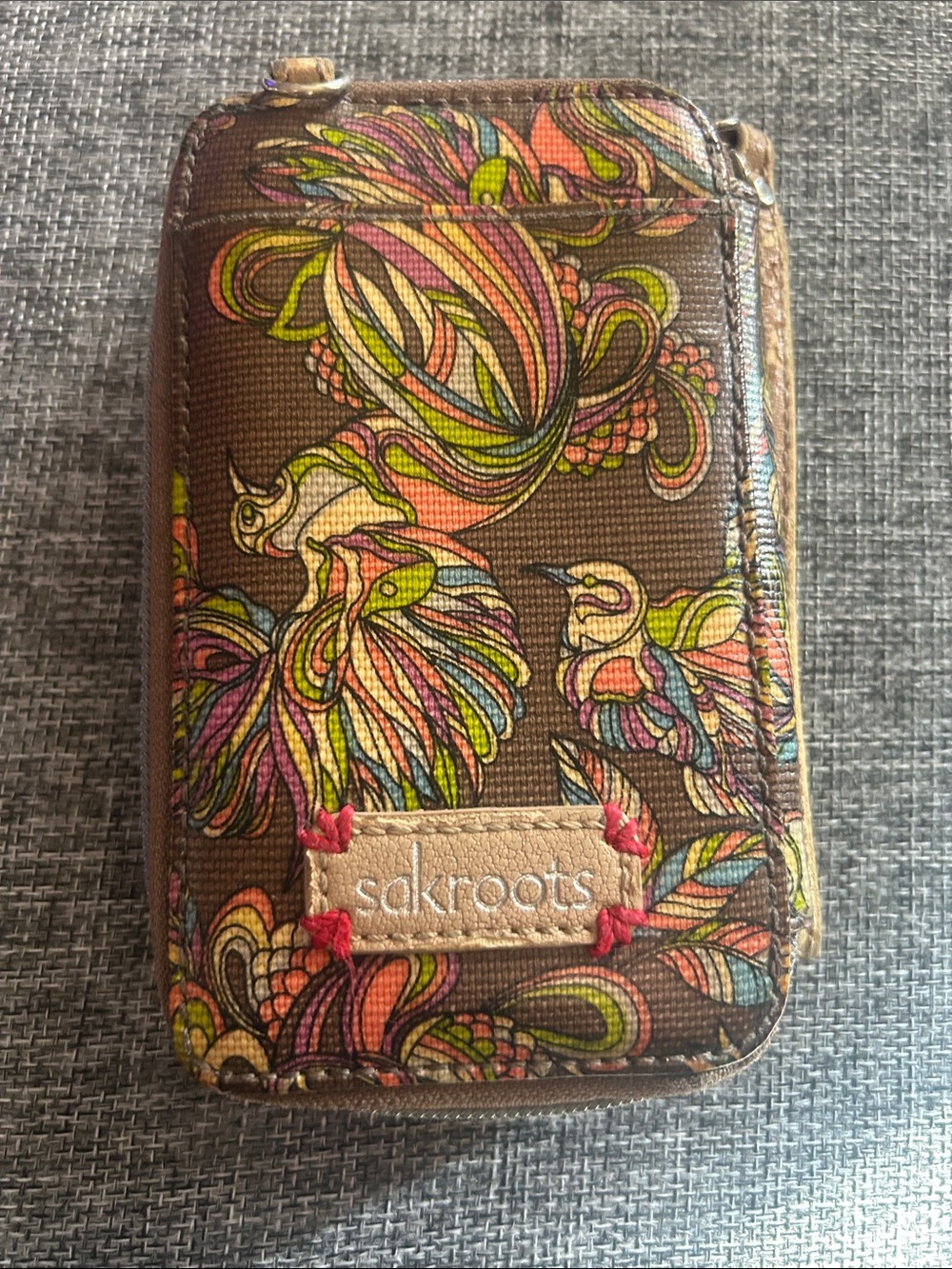 Sakroots “Peace” Brown Canvas Phone Wallet with Multicolor Floral & Bird Print
